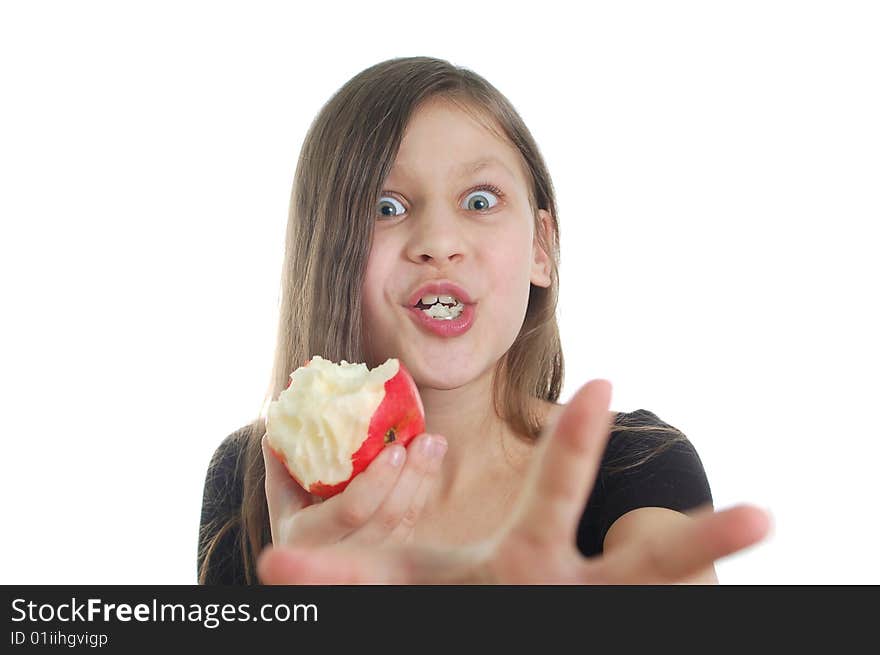 The cute little girl eating the apple. The cute little girl eating the apple