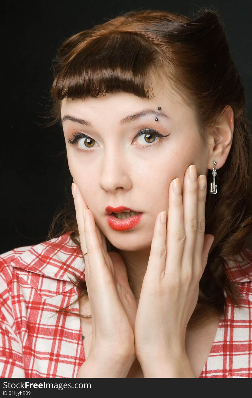 Frightened pretty retro-style woman over dark background. Frightened pretty retro-style woman over dark background