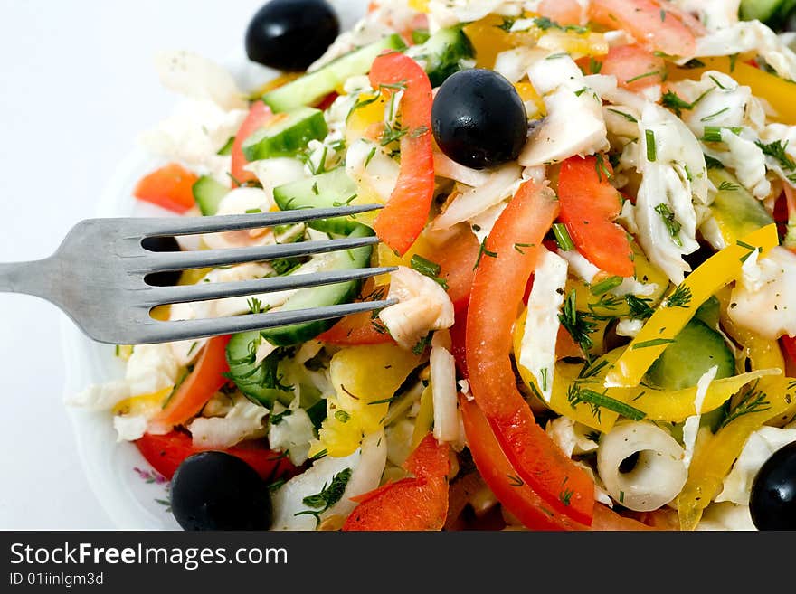 Stock photo: an image of fork and fresh salad. Stock photo: an image of fork and fresh salad