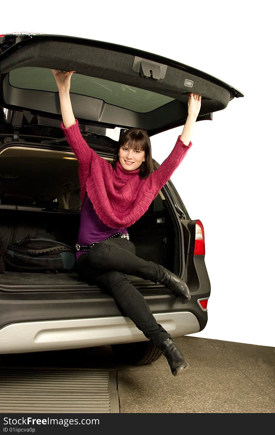 Pretty women sit in car boot. Pretty women sit in car boot