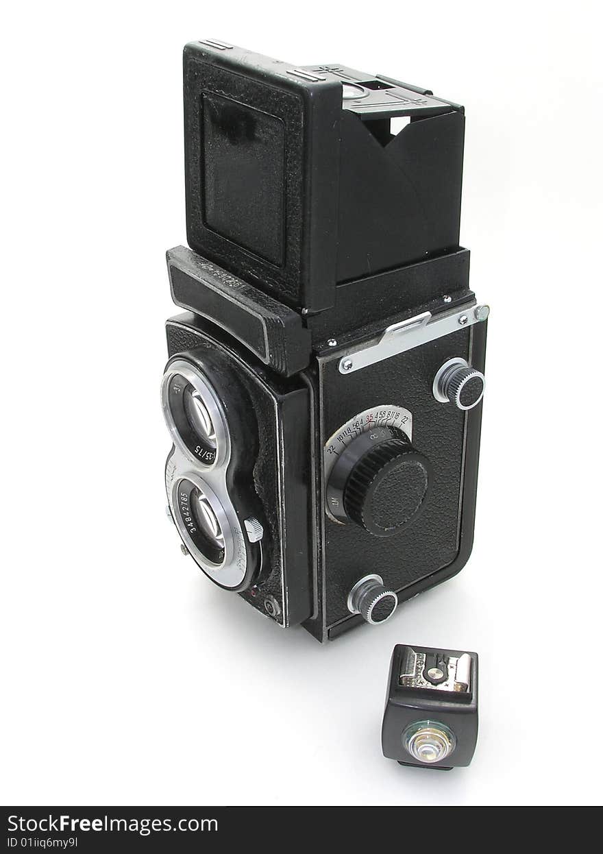 A 120mm film double lens camera over white background.