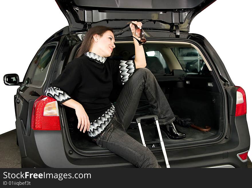 Pretty women sit in car boot. Pretty women sit in car boot