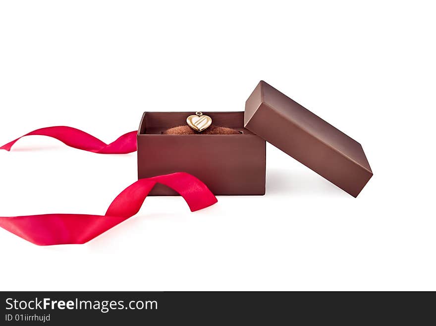 Box with gold heart and  ribbon  on white