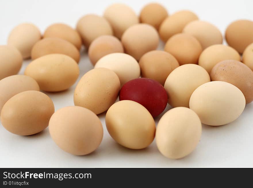 Easter eggs on white background, focus on red egg