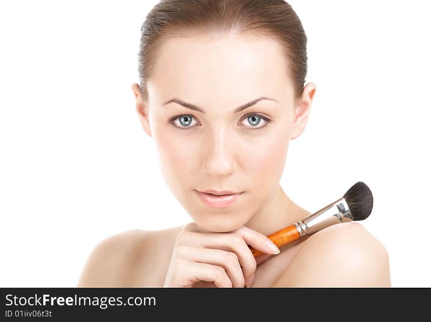 Portrait of the girl with a brush for the powder, isolated. Portrait of the girl with a brush for the powder, isolated