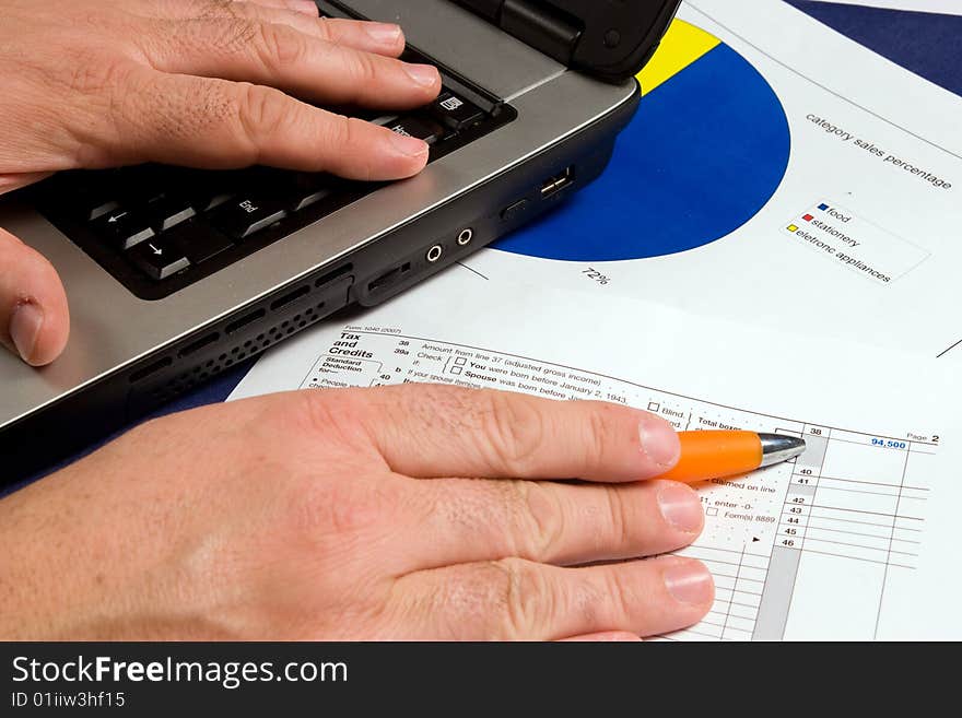 Hands working on computers and business relations