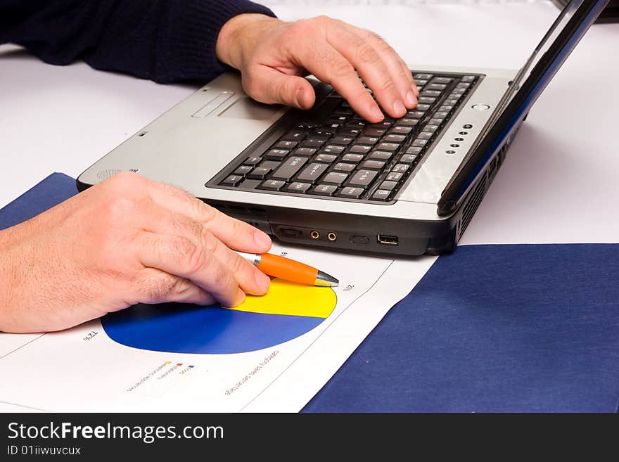 Hands working on computers and business relations