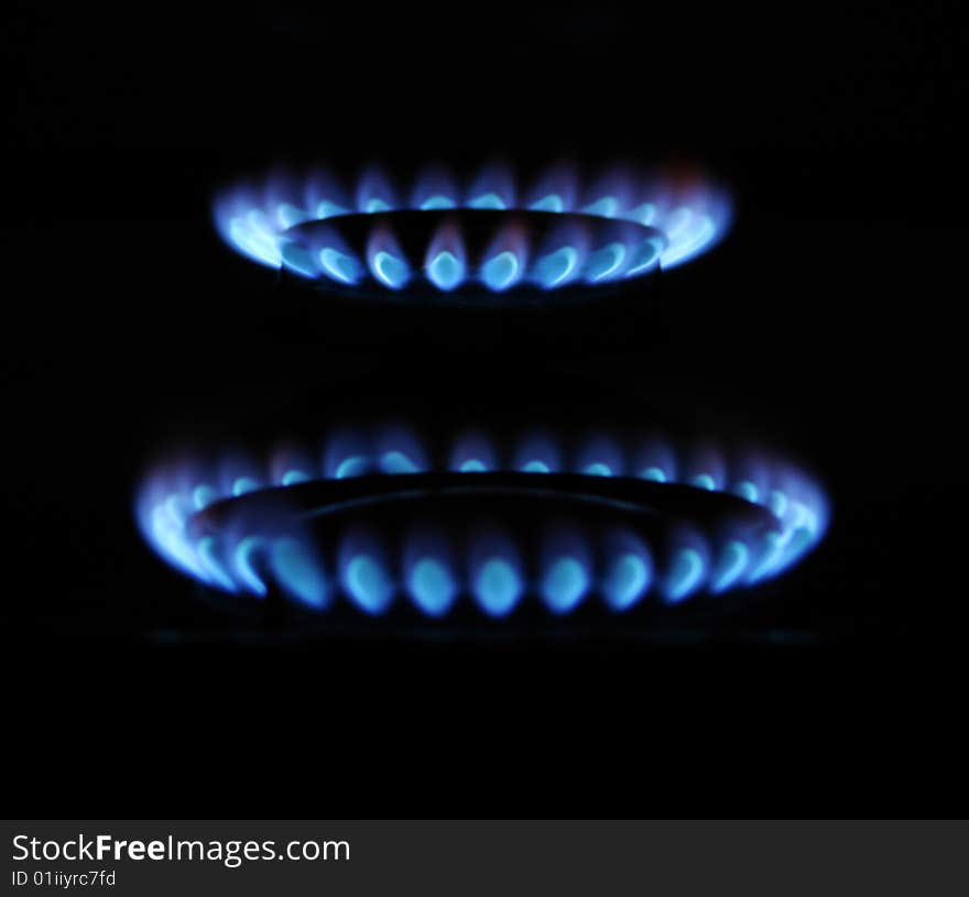 Flames of gas stove in the dark