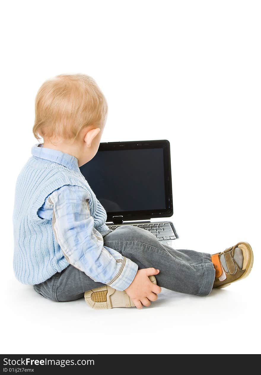 Concept of little businessman. Little child and laptop. Isolated on white background