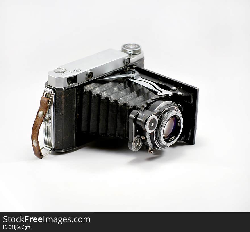 Old film photo camera and isolated on a white background