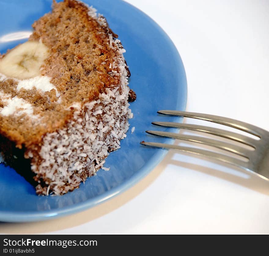 Piece of cake on a blue saucer