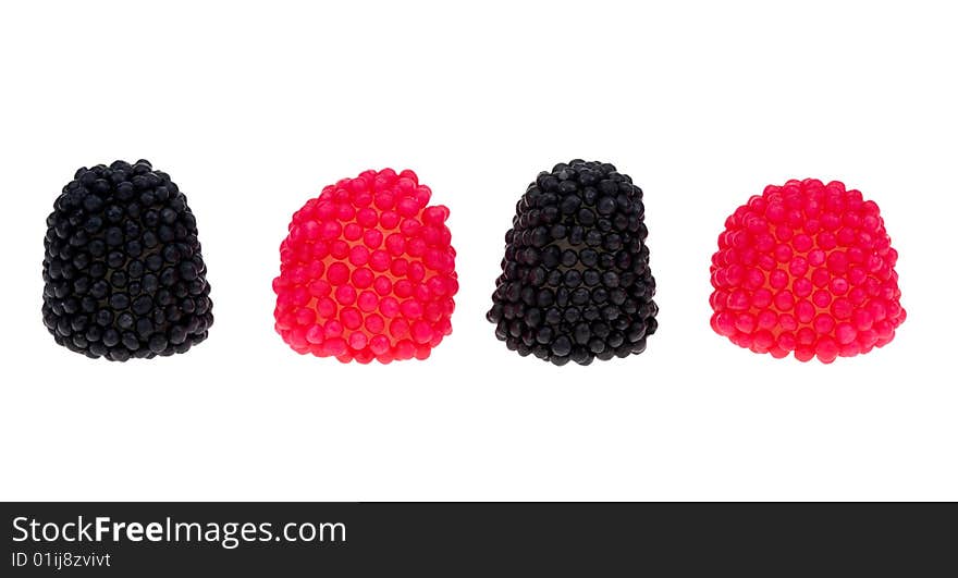 Black and red berry shaped candies isolated on a white background