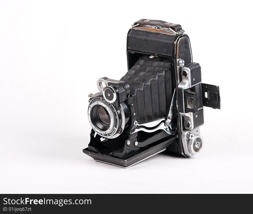 Photo of vintage photocamera on the white background. Photo of vintage photocamera on the white background