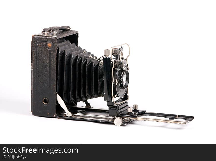 Photo of vintage photocamera on the white background. Photo of vintage photocamera on the white background