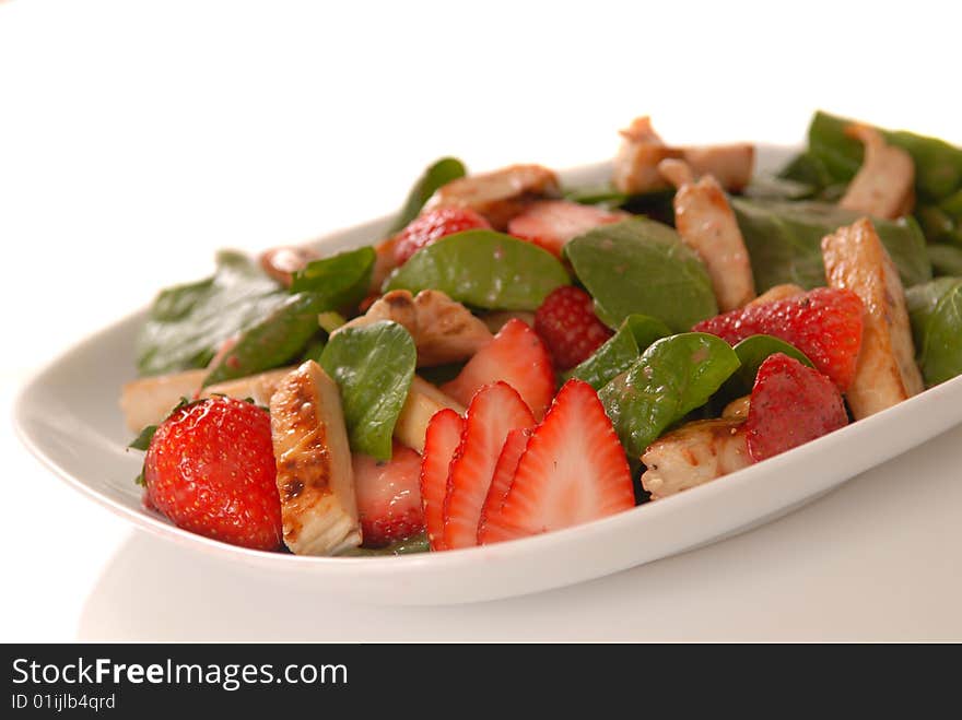 Fresh spinach and strawberry salad with grilled chicken