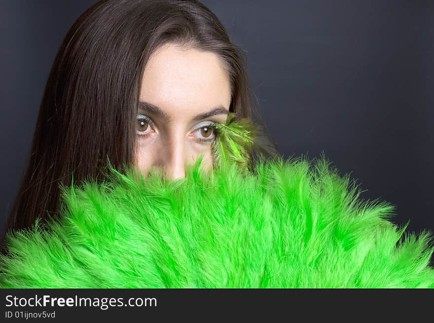 Portrait attractive young woman with green fan. Portrait attractive young woman with green fan