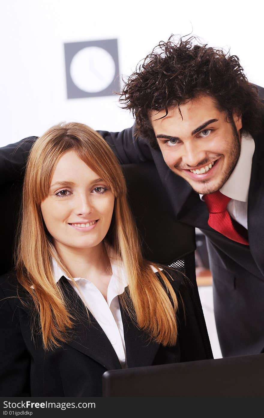 Worker couple uses laptop