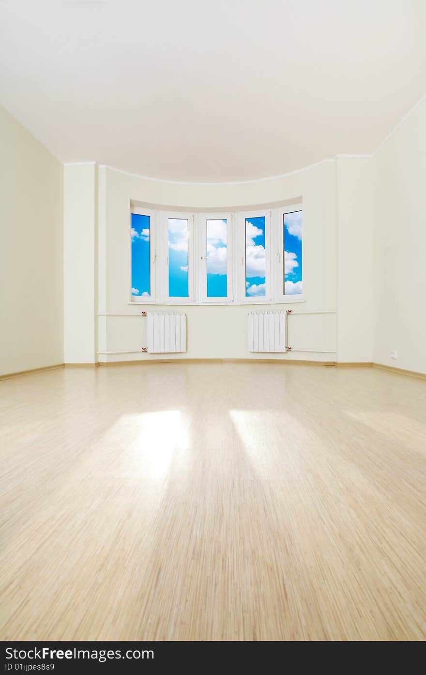 Interior of the empty room filled with light from a window. Interior of the empty room filled with light from a window