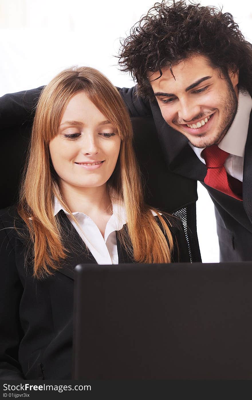 Worker couple uses laptop