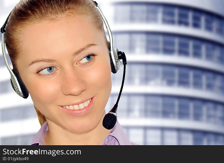 Woman wearing headset in office;could be reception