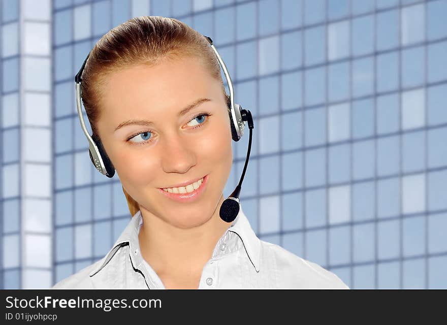 Woman wearing headset in office;could be reception