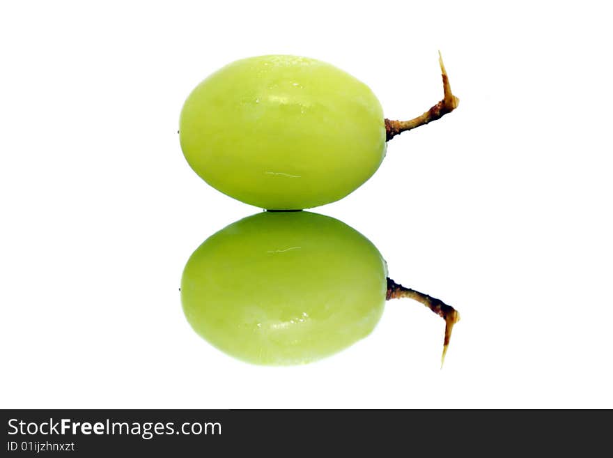 Close up of a green grapes isolated over white background.