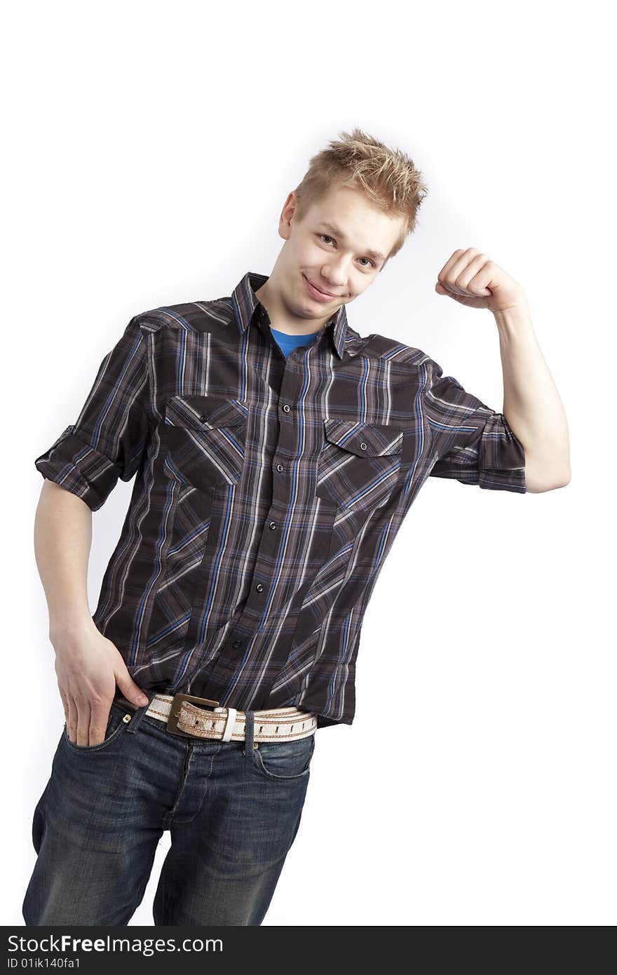 Isolated teen boy posing and pointing finger over white background. Isolated teen boy posing and pointing finger over white background