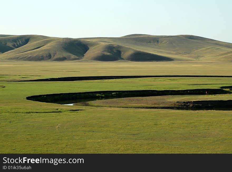 Beautiful blue sky and white clouds of cattle and sheep on the grasslands. Beautiful blue sky and white clouds of cattle and sheep on the grasslands