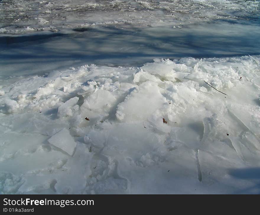 Ice built up on frozen river bank