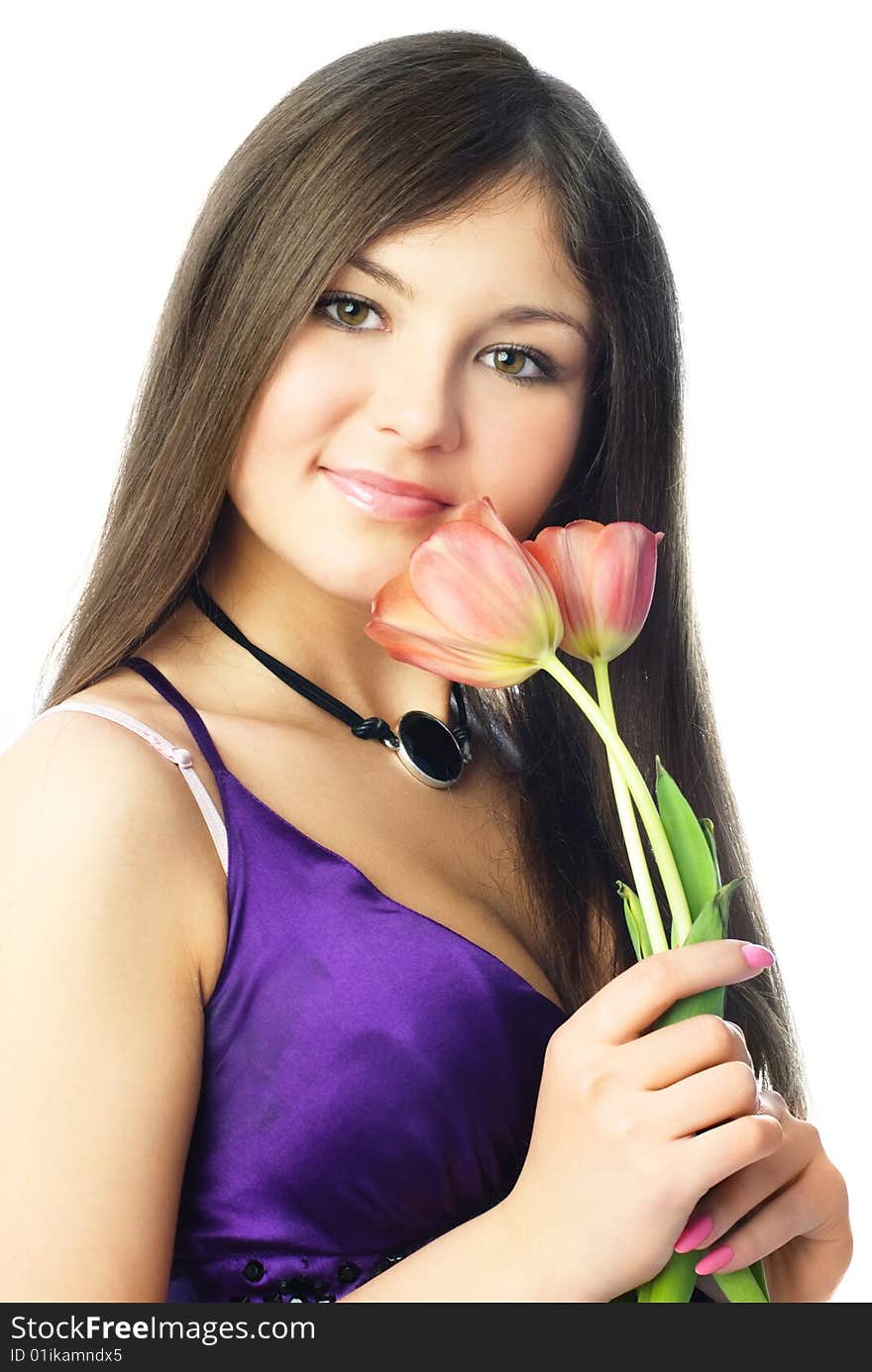 Portrait of a beautiful young woman holding two tulips in her hands. Portrait of a beautiful young woman holding two tulips in her hands