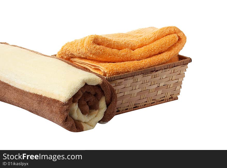 Towels and wonderful basket isolated on a white background. Towels and wonderful basket isolated on a white background.