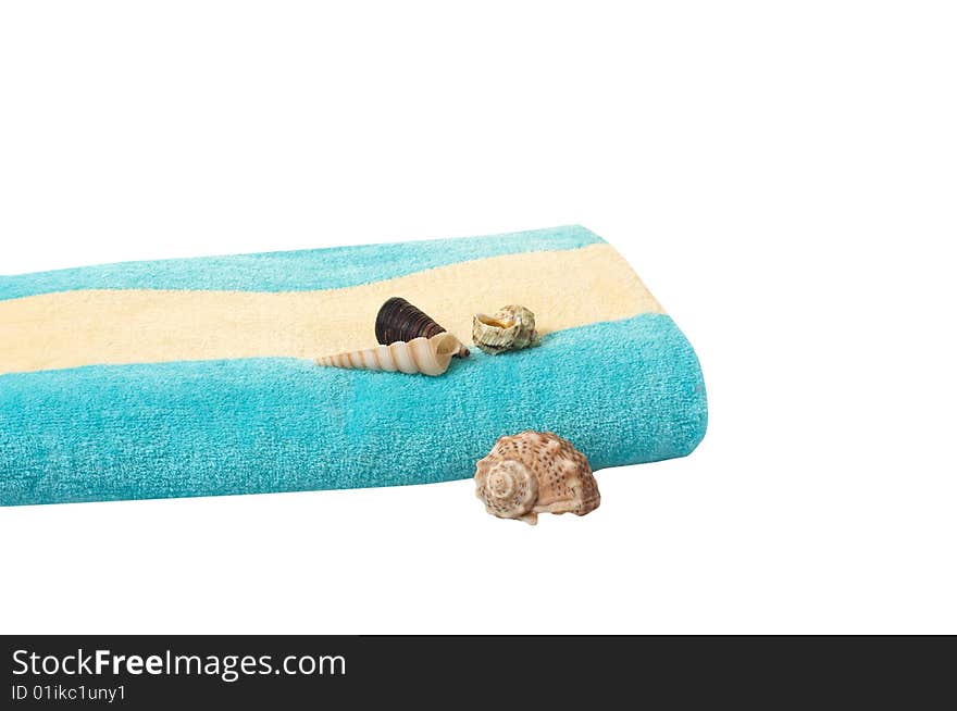 Turquoise towel and seashells.