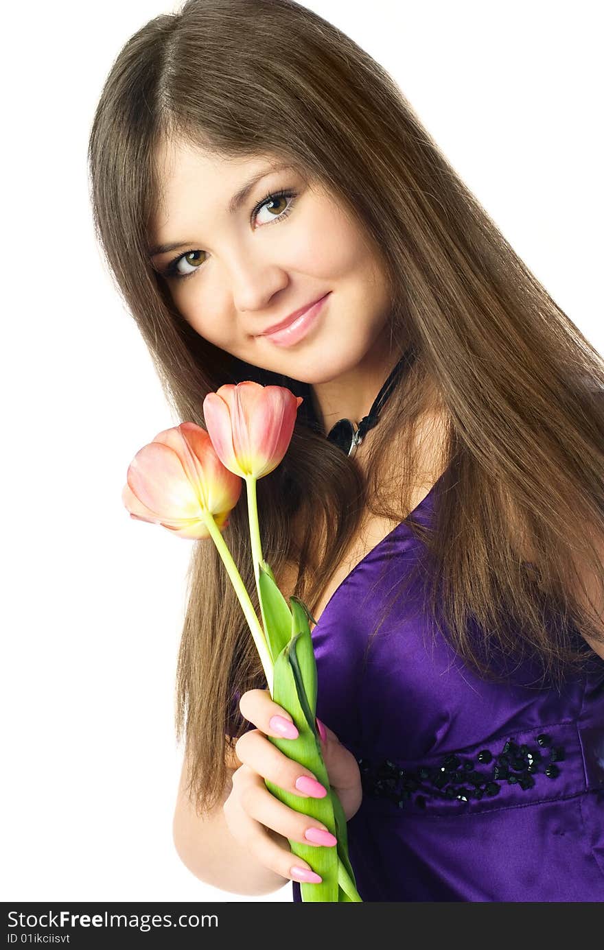 Portrait of a beautiful young woman with tulips in her hands. Portrait of a beautiful young woman with tulips in her hands