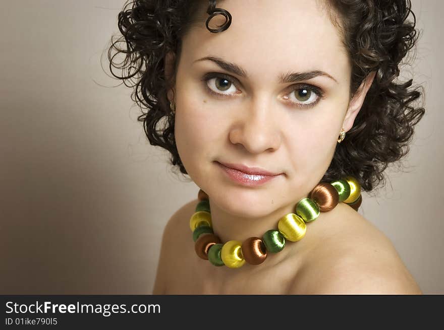 The beautiful girl on a grey background. The beautiful girl on a grey background