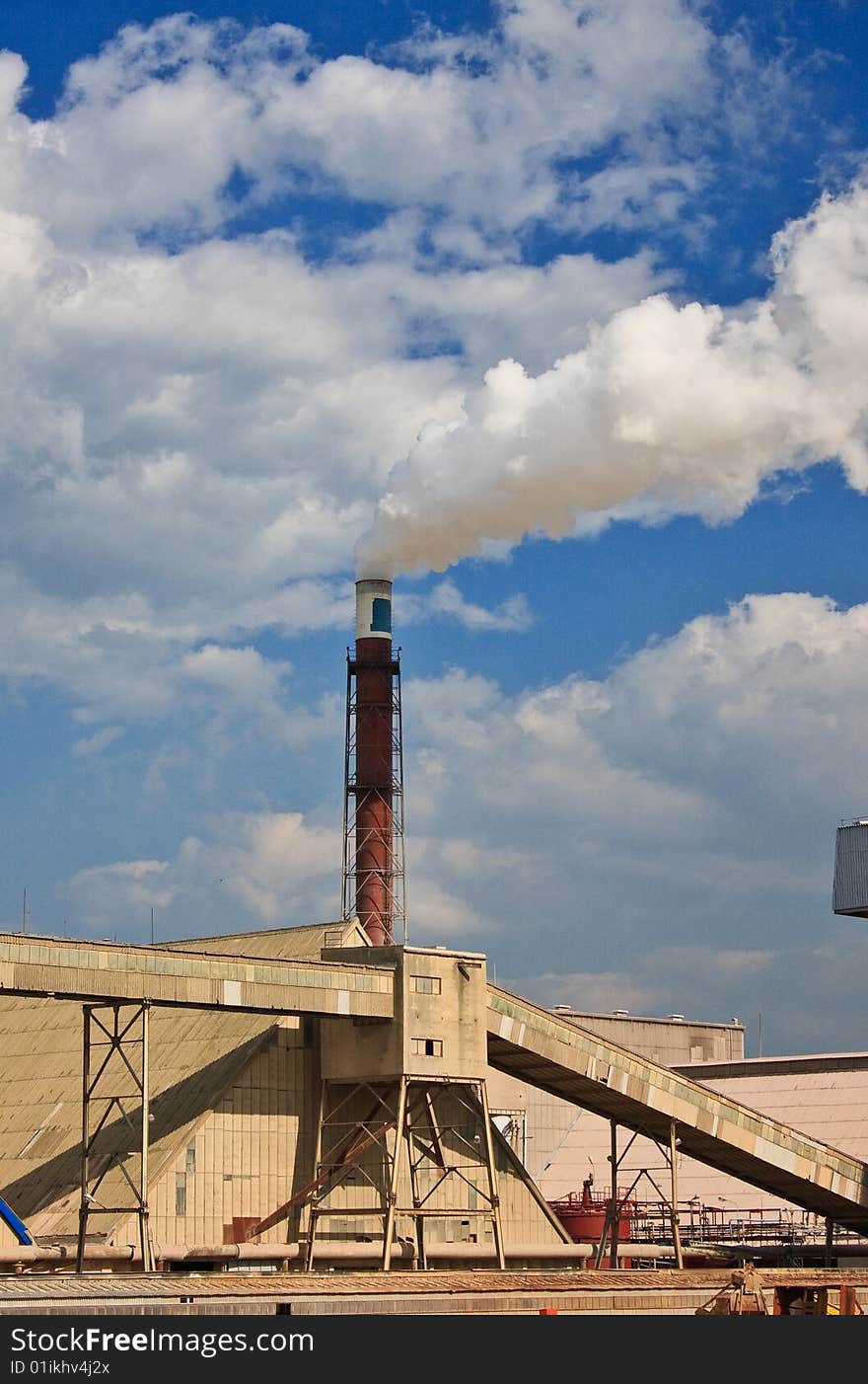 Smokestack of the plant and white smoke