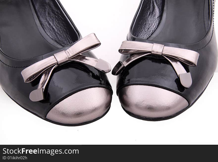 Black female shoes detail isolated on white background.