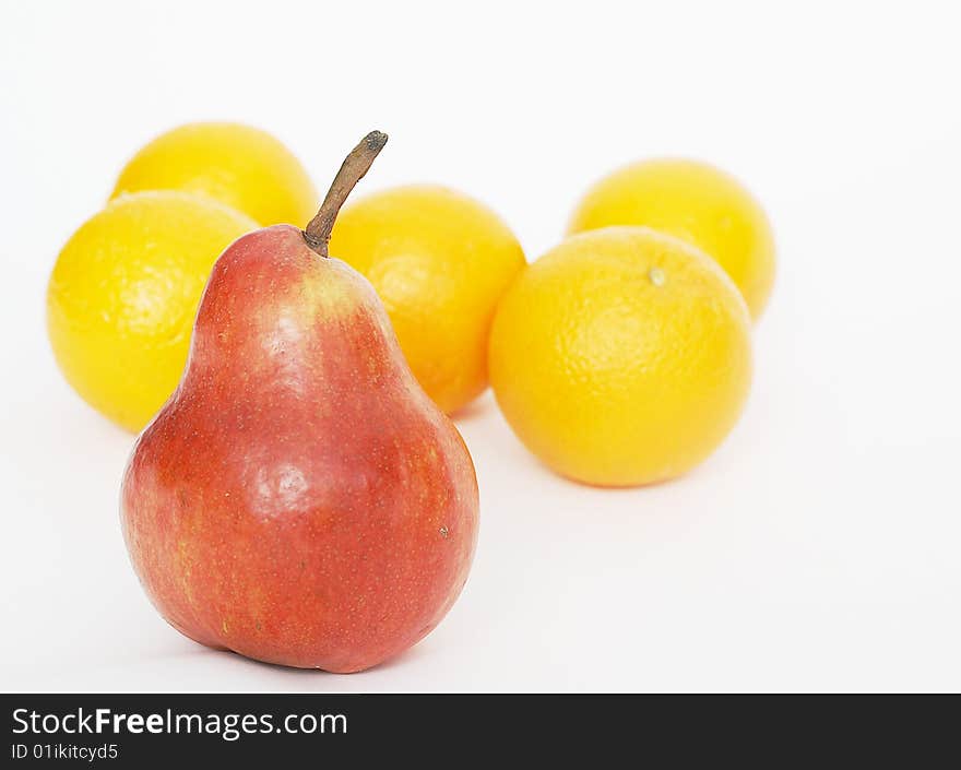 Oranges Behind A Red Pear