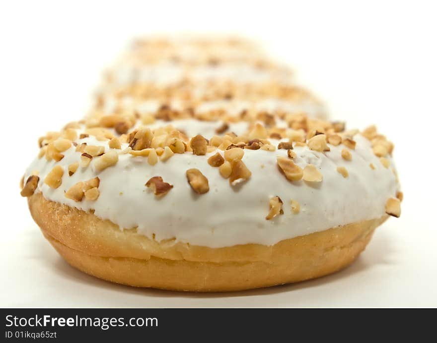 Donuts with sugar glaze and nuts