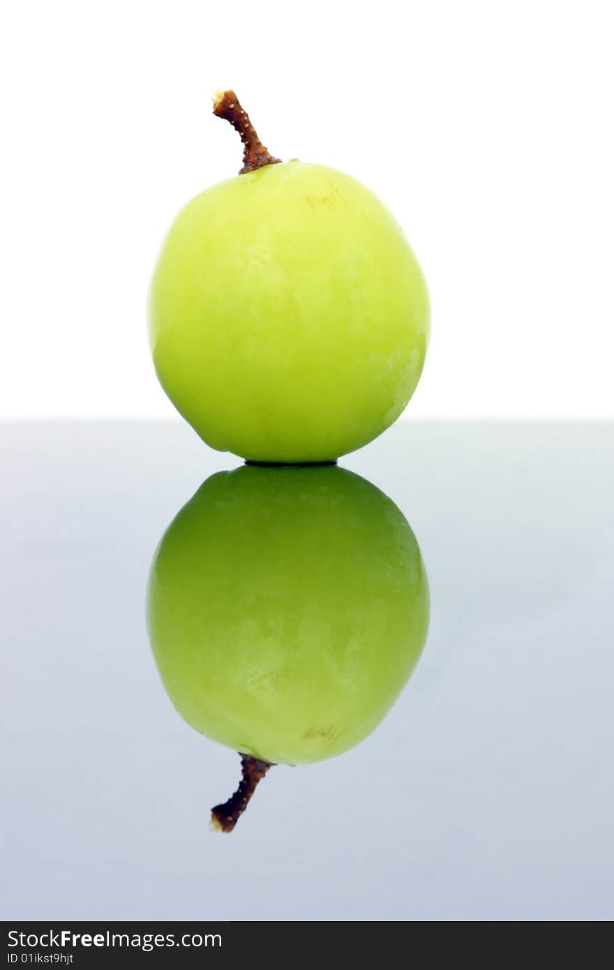 Close up of a green grapes isolated over white background.