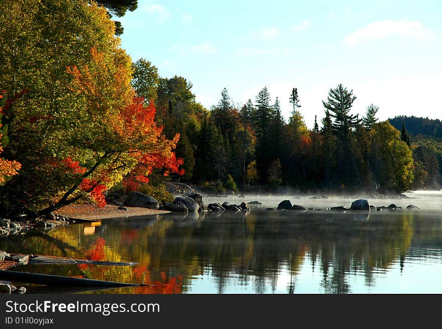 Sheltered lake shore at sunrise