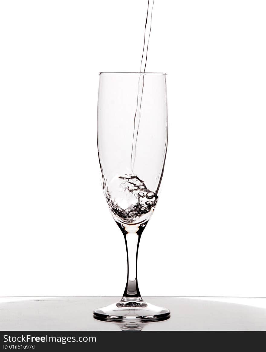 Glass of pouring water