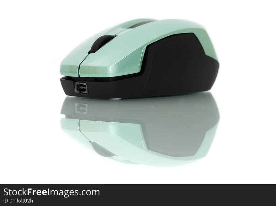 A wireless mouse isolated on white background with mirror reflection.