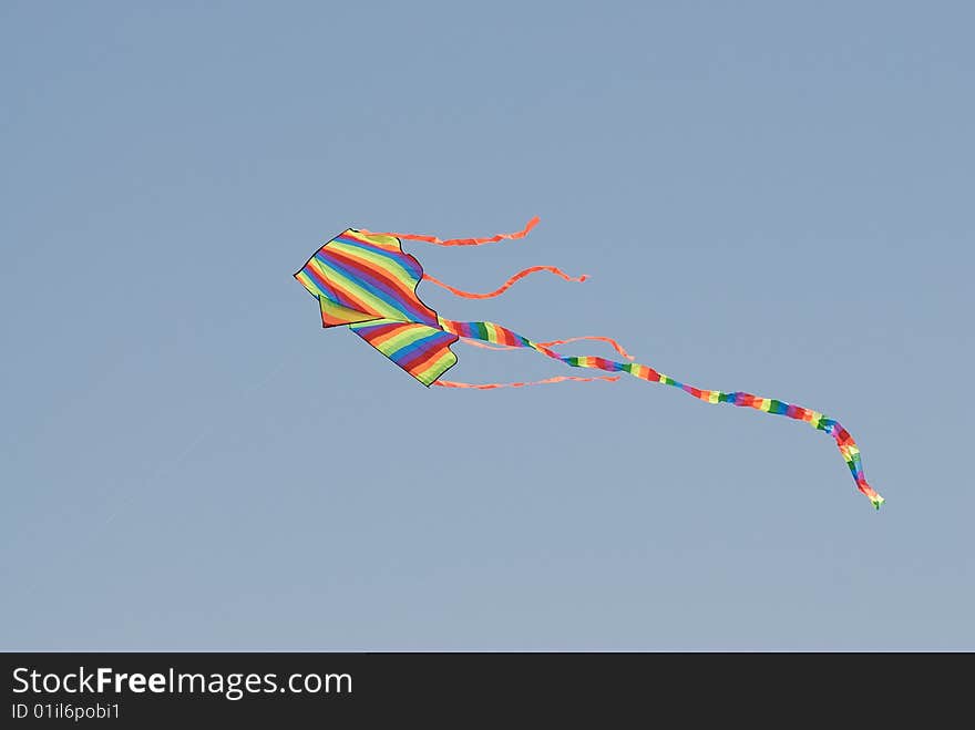 Flying kite isolated on blue sky