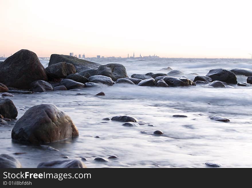 Stony shore with view of Tallinn. Stony shore with view of Tallinn