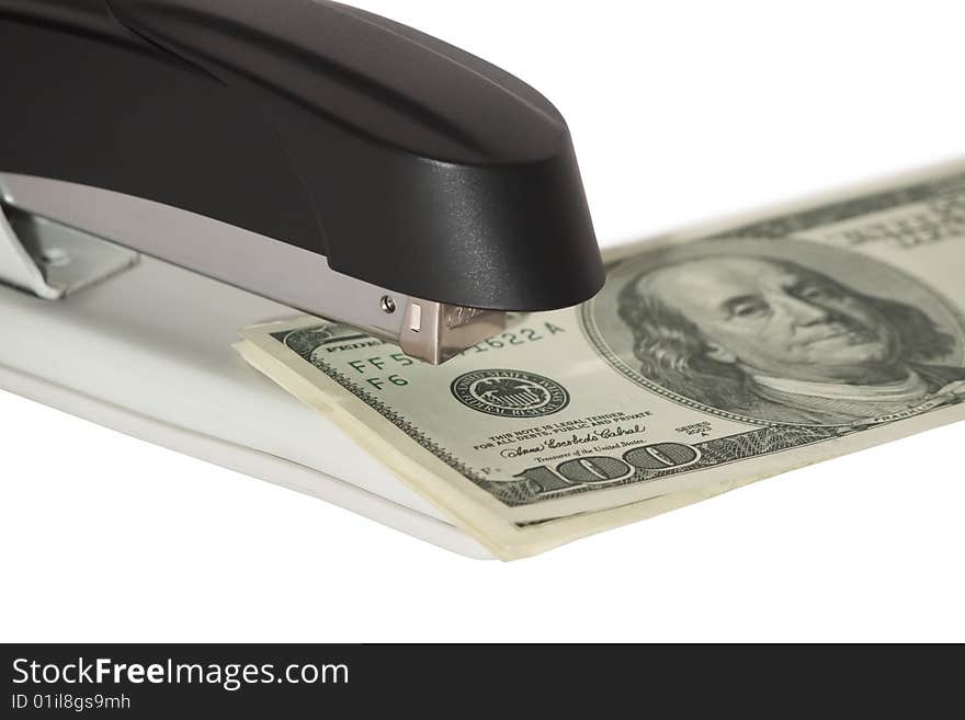 Stapler with stack of dollars isolated on white background. Stapler with stack of dollars isolated on white background