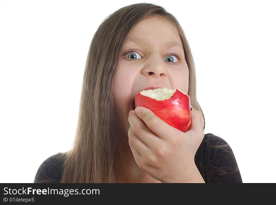 The cute little girl eating the apple. The cute little girl eating the apple