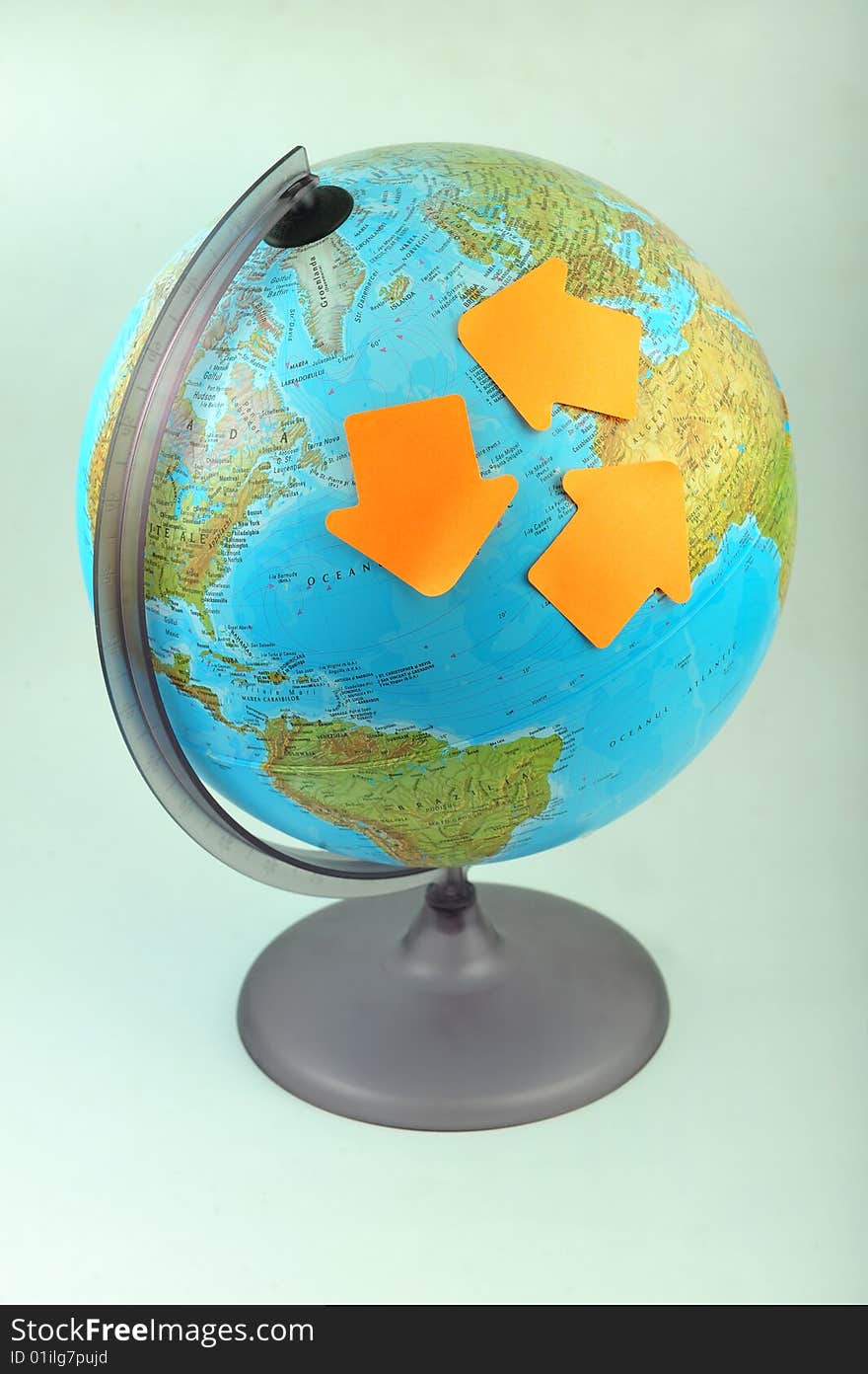 Recycle concept, three green arrow labels on Earth globe