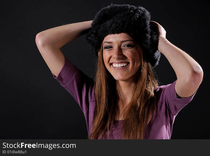 Woman in a fancy russian hat over black