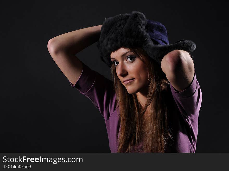 Woman in a fancy russian hat over black