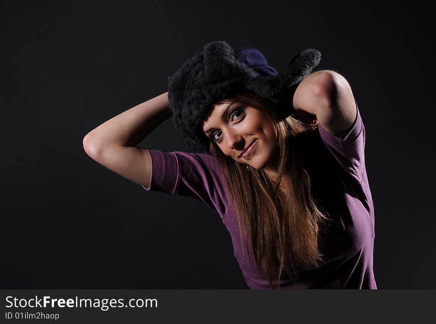 Woman in a fancy russian hat over black